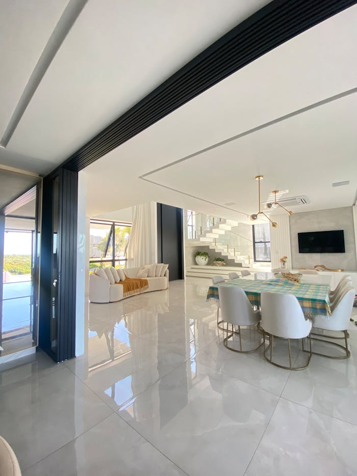 Elegant living room in Vila Velha showcasing modern luxury design with open space and natural light.