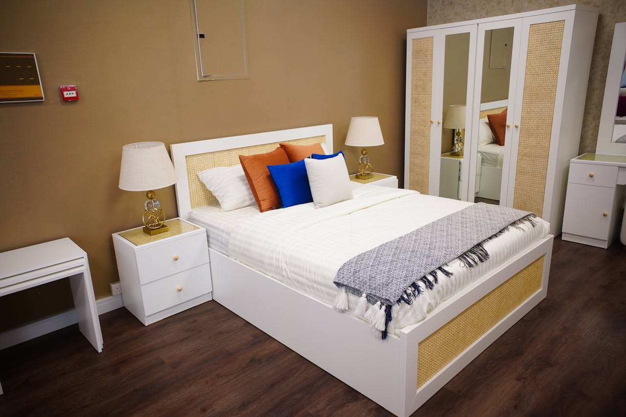 Modern bedroom with elegant decor, featuring a cozy bed and stylish furniture in Ajman, UAE.