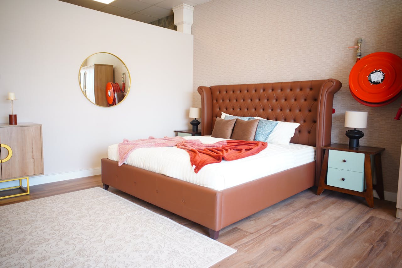 Sophisticated modern bedroom featuring luxury furniture and warm tones in Ajman, UAE.